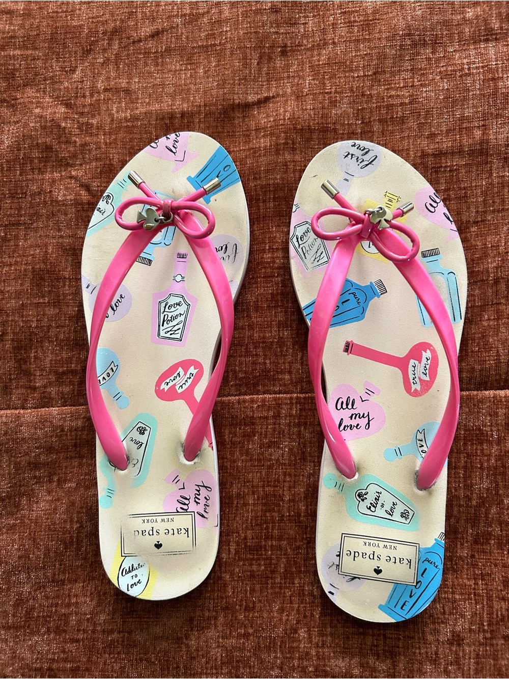 kate spade nova Pink Bow Flip Flops with Pastel Perfume Bottle Print size 10